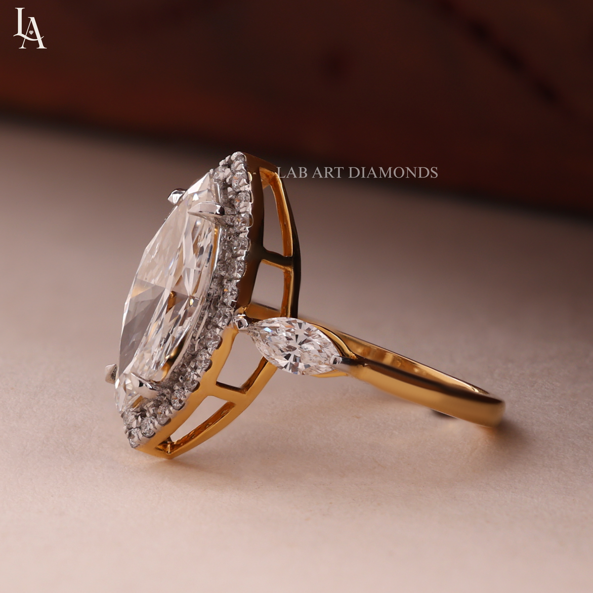 Marquise-Cut Three Stone Halo Engagement Ring
