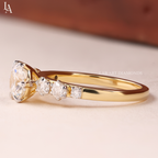 Round Cut Graduated Side Stone Engagement Ring