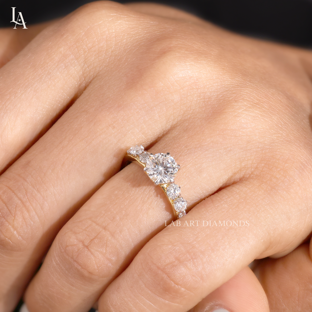 Round Cut Graduated Side Stone Engagement Ring